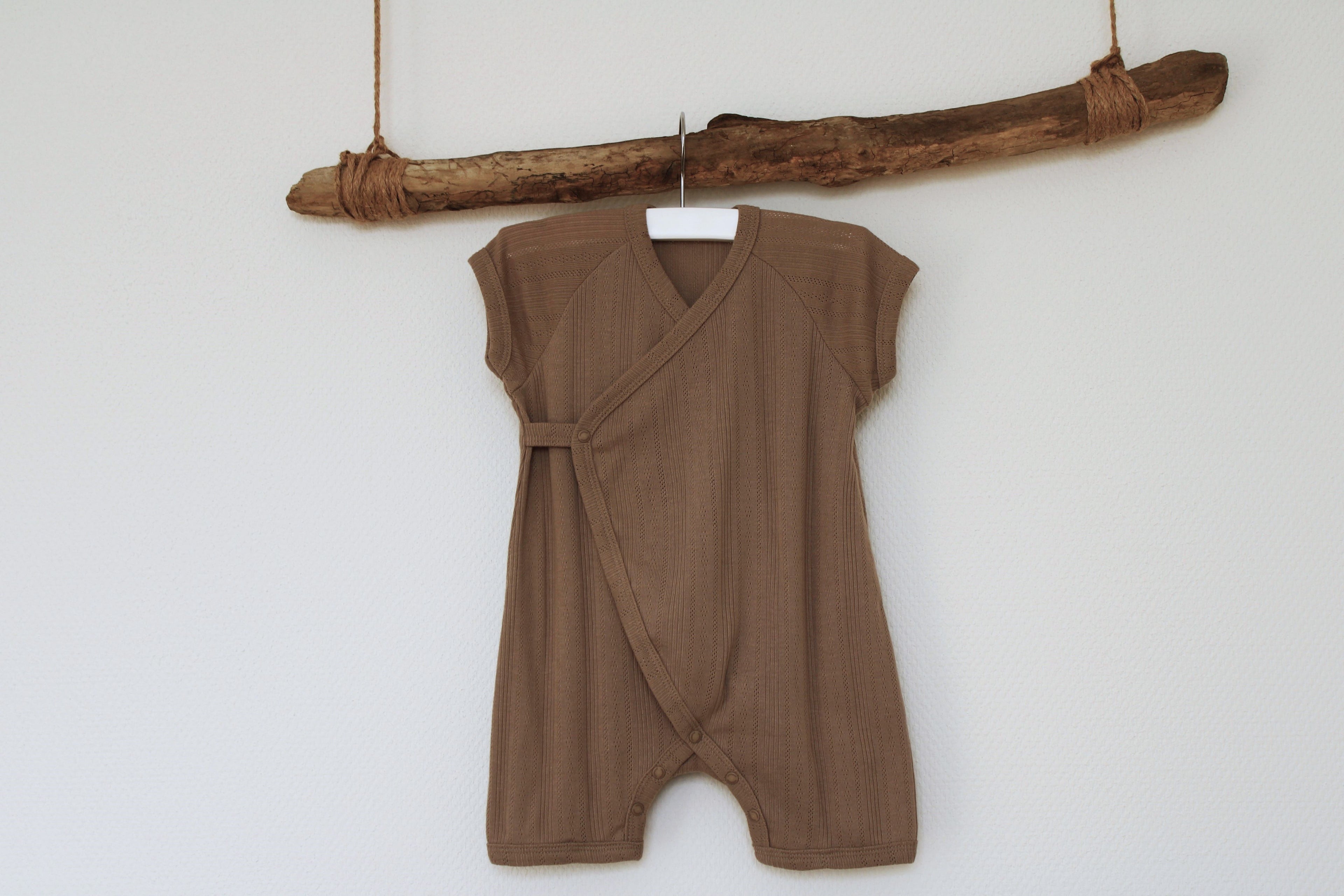 Sweetpea three-piece newborn bodysuit front side